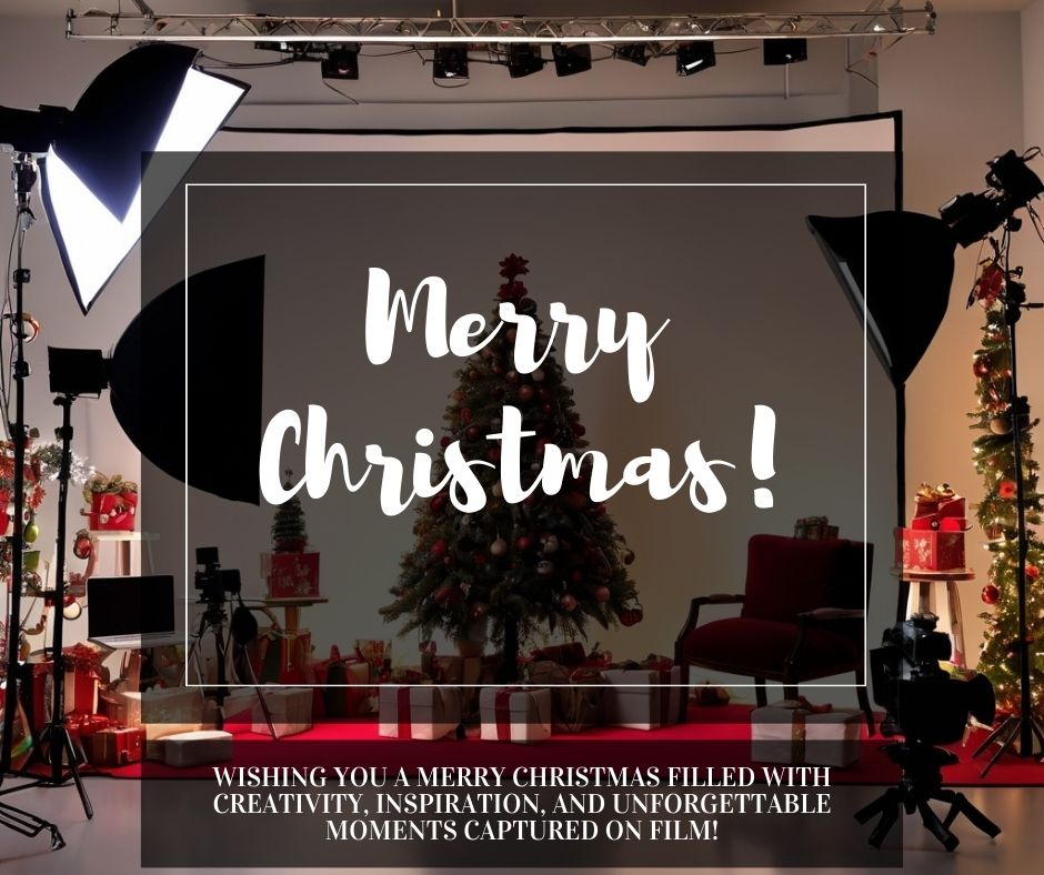 A video production studio with cameras and lights, decorated with Christmas ornaments and a festive holiday scene.